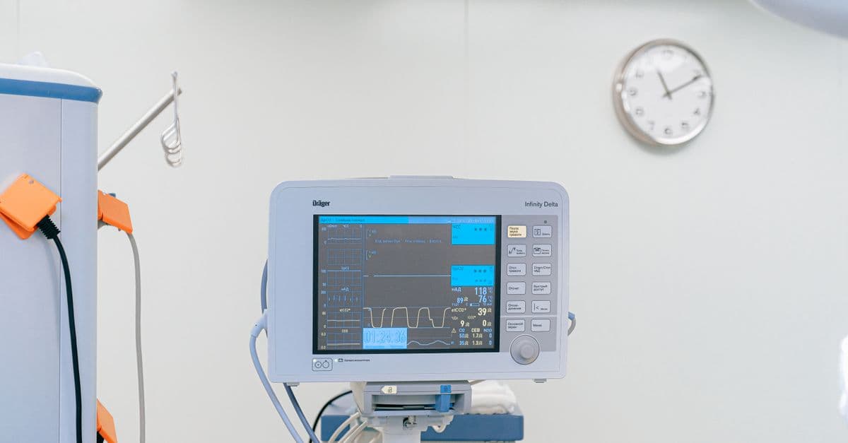 A modern heart rate monitor in a sterile hospital setting, showcasing medical technology.